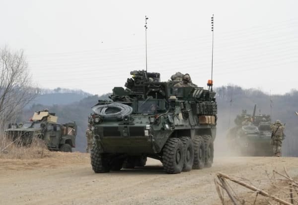 North Korea fires 10 missiles into Sea of Japan amid drills