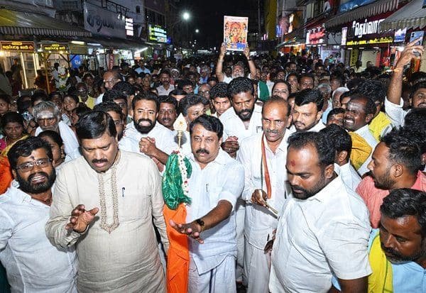 Devotees hold Tirupparankundram girivalam urging lamp at hilltop pillar